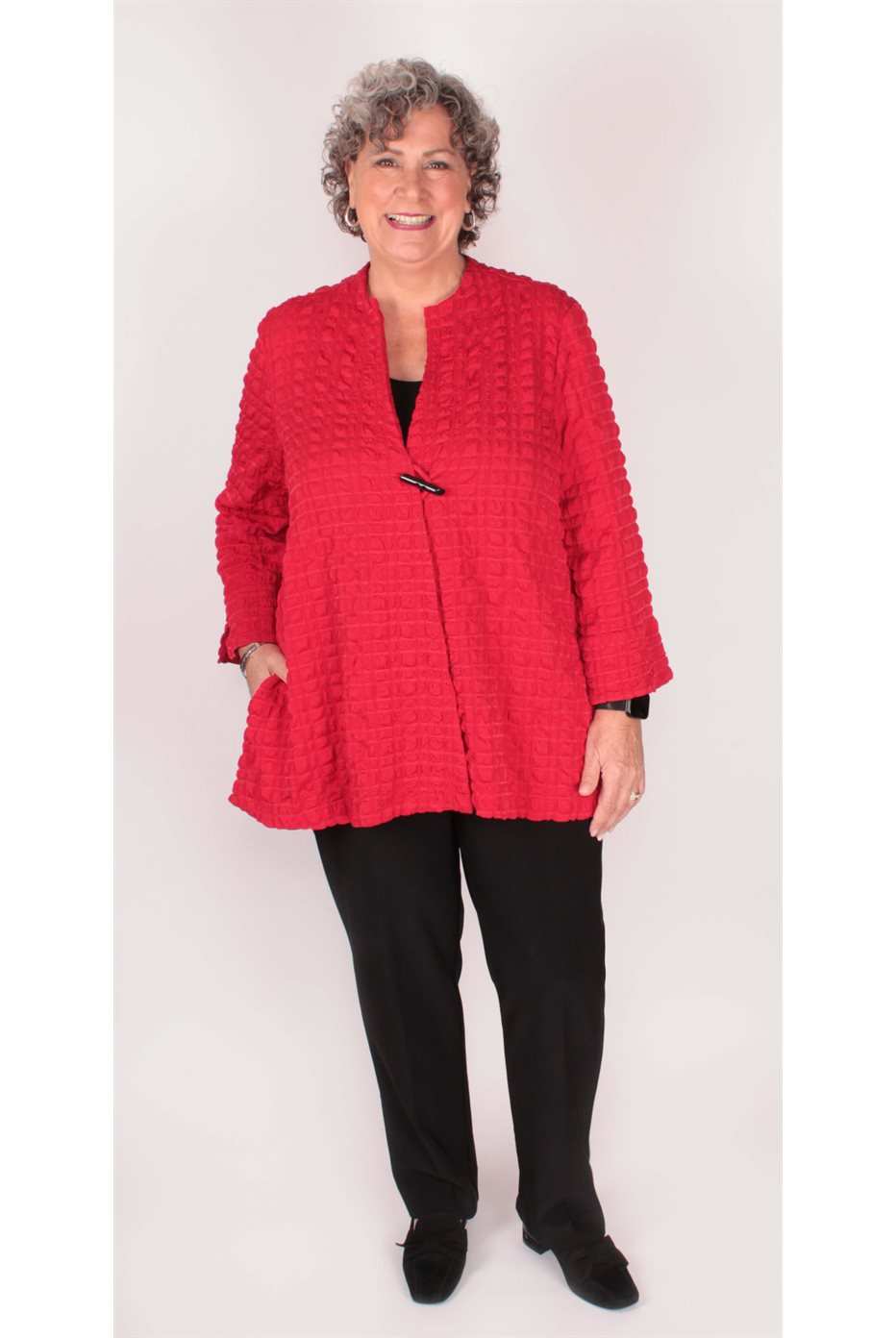 Blouson trapèze rouge en jacquard à bulles